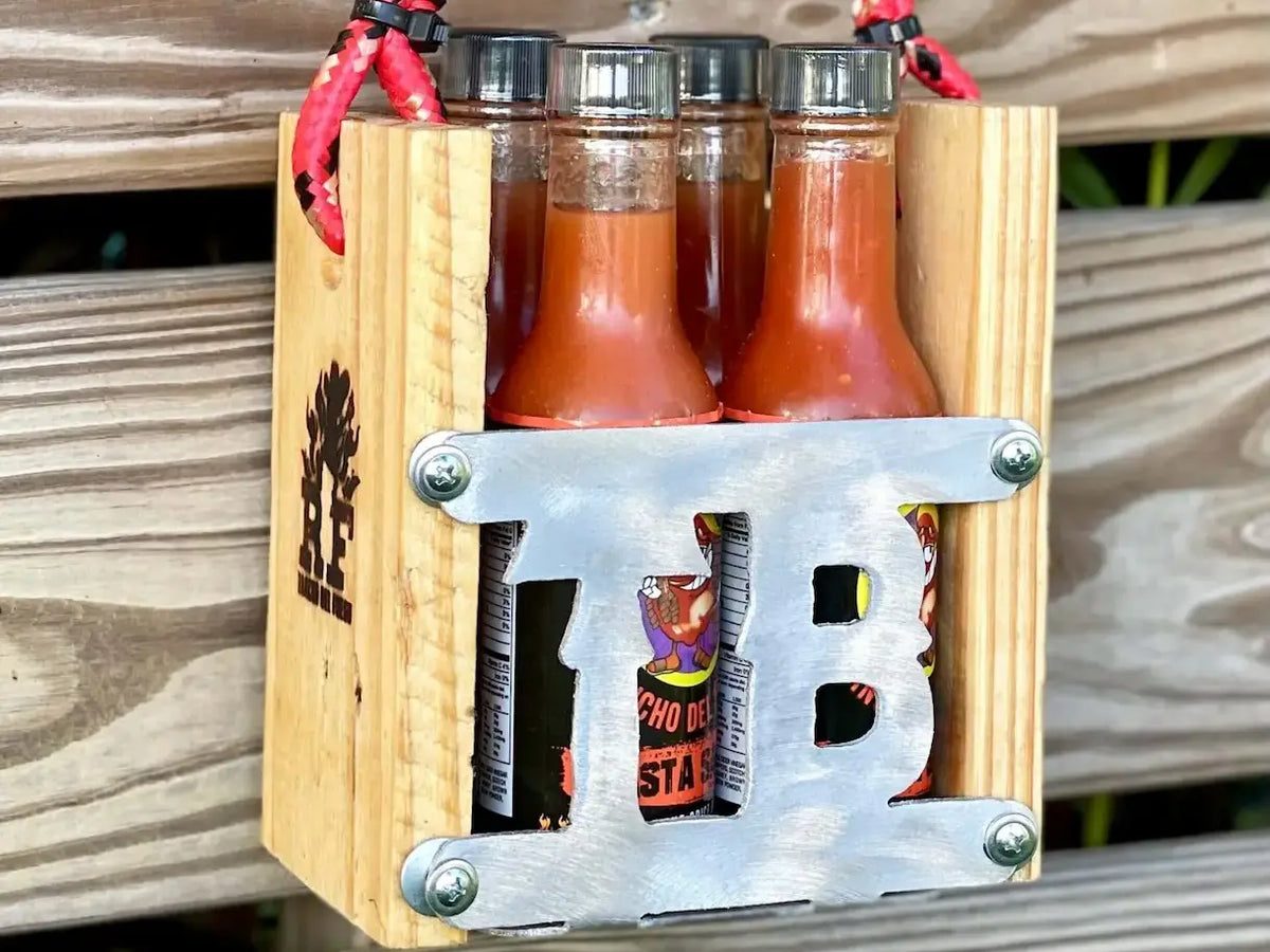Four Hot Sauce Bottles and a Caddy